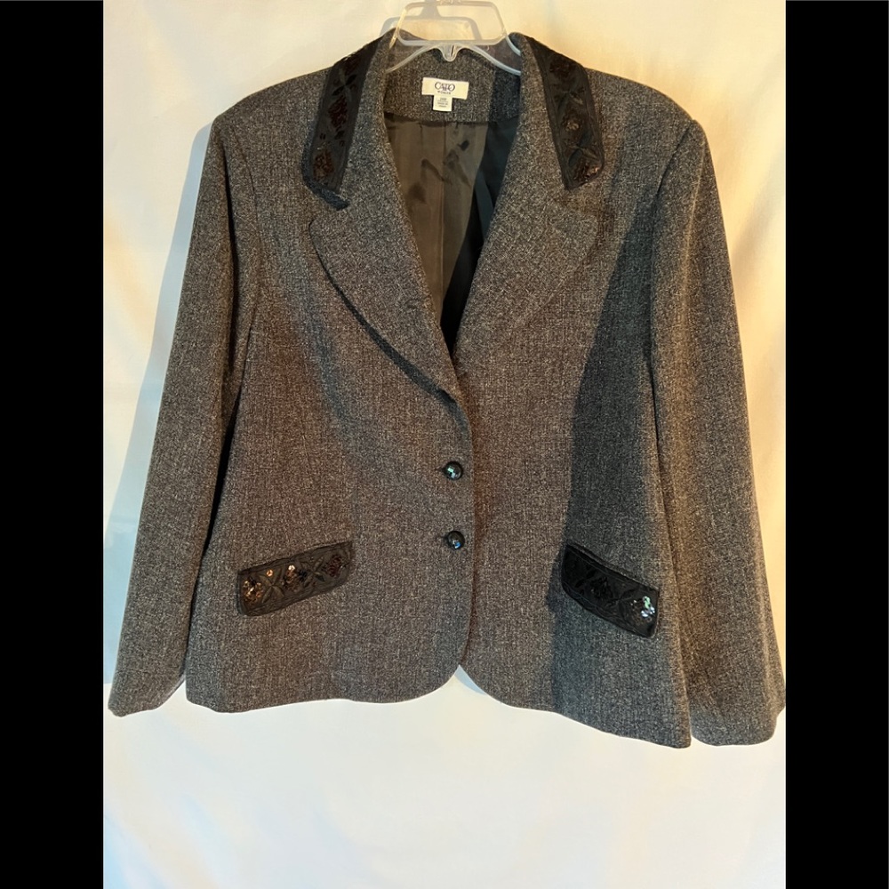 Women’s gray suit with black sequins on collar, skirt, and pocket cuffs.
